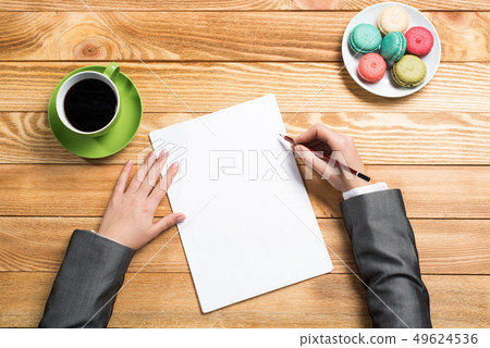 Businesswoman making some notes Businesswoman making some notes 49624536