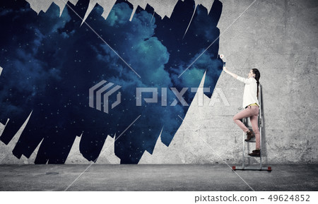 Girl paint wall in colors 49624852