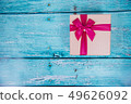 Gift Box on Blue Background 49626092