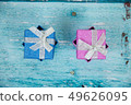 Gift Boxes on Blue Background 49626095