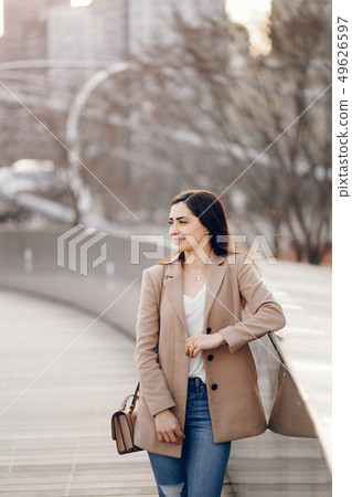 Fashion girl walking in a sspring park 49626597