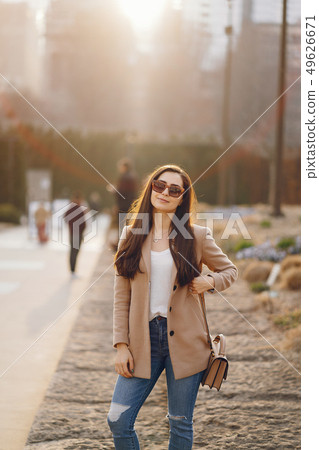 Fashion girl walking in a sspring park 49626671