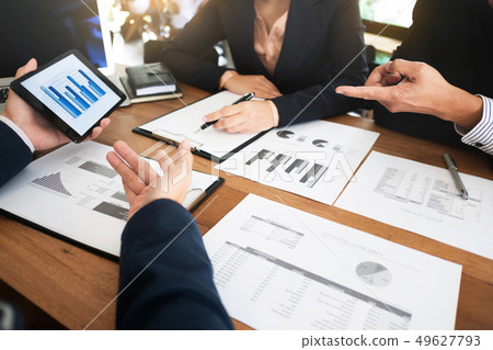 financial business. Two young executives partner discussing with 49627793