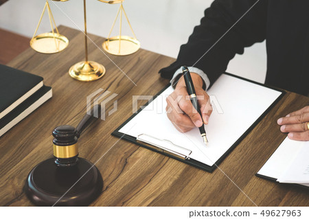 justice lawyer / judge gavel working with legal documents in a c 49627963
