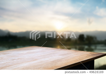 wood tabletop with blurred amazing landscape background. 49628189