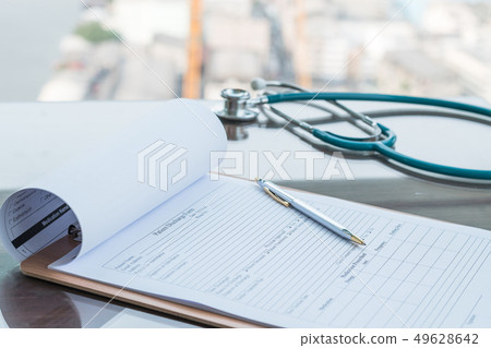 Doctor working table with patient discharge blank Doctor working table with patient discharge blank 49628642