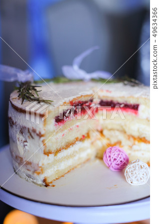 Cut delicious cake on plate. 49634366