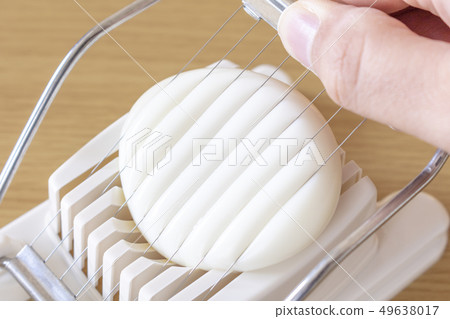 Image of using egg slicer Image of using egg slicer 49638017