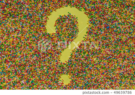 Question mark symbol written in sprinkles. Question mark symbol written in sprinkles. 49639786
