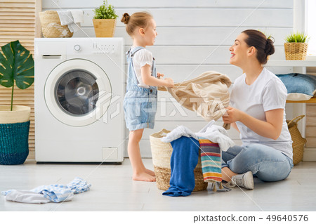 family doing laundry family doing laundry 49640576