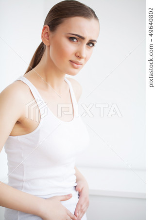 Stomach pain. Woman having painful stomachache,Female suffering from abdominal pain 49640802