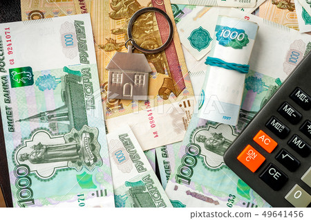 Keychain on the background of russian ruble banknotes Keychain on the background of russian ruble banknotes 49641456