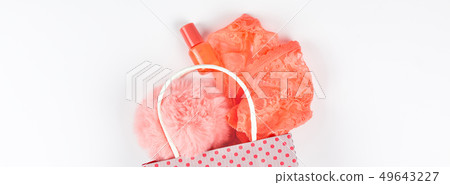 Coral lingerie in shopping bag on white background Coral lingerie in shopping bag on white background 49643227
