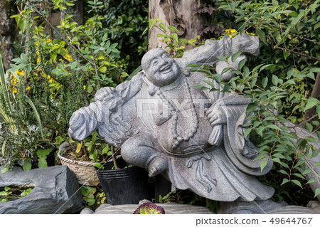 Figure laughing sitting Buddha in the open air 49644767