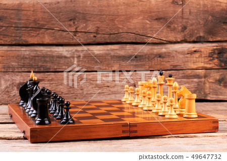 Chess board with chess pieces before game. Chess board with chess pieces before game. 49647732