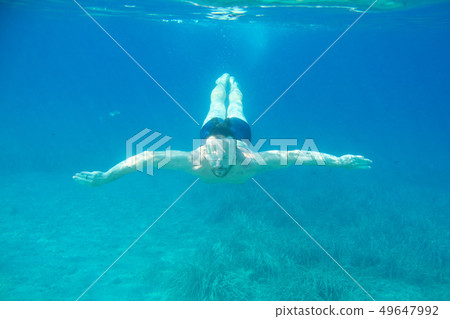Man diving swimming underwater view 49647992