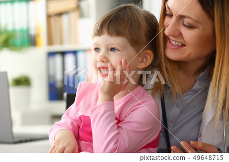Cute little girl visiting family doctor office 49648715