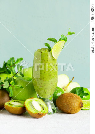 One glass of fresh green fruit smoothie One glass of fresh green fruit smoothie 49650896