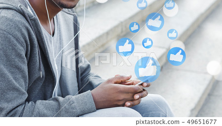 Man using smartphone, playing social media and website 49651677