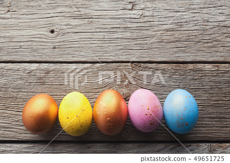 Easter eggs on wooden background. Easter eggs on wooden background. 49651725