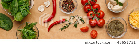 Spices and ingredients for homemade pizza on wooden table Spices and ingredients for homemade pizza on wooden table 49651731