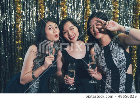 young people with cocktails at pub taking picture 49656829