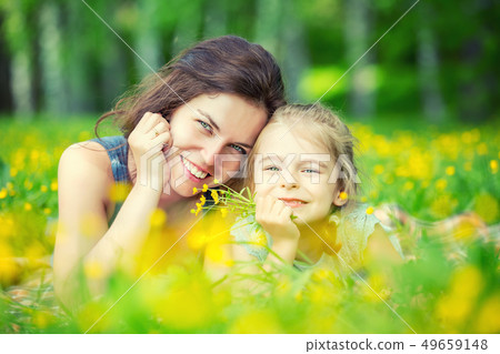 Mother and daughter on sunny meadow 49659148