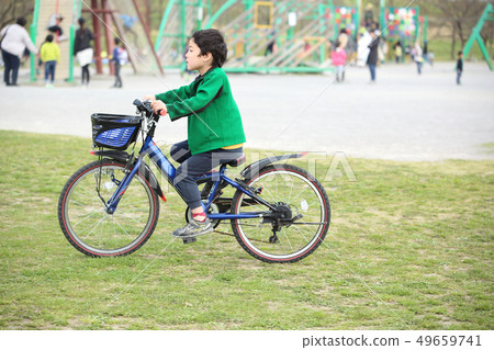 child riding a bicycle 49659741