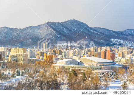 Beautiful architecture building with mountain landscape in winter season Sapporo city Hokkaido Japan Beautiful architecture building with mountain landscape in winter season Sapporo city Hokkaido Japan 49665054
