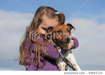 jack russel terrier and child 49665724
