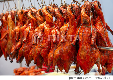 row of red roasted duck hanging in chinese row of red roasted duck hanging in chinese 49670175