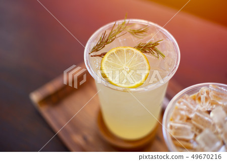 ice lemon soda juice on wooden table. fresh fruite ice lemon soda juice on wooden table. fresh fruite 49670216