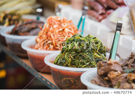 Eastern delicacies on sale at a street market Eastern delicacies on sale at a street market 49670774
