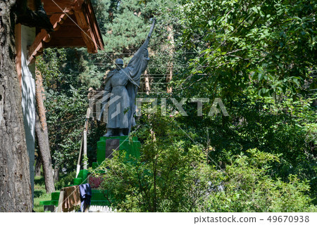 Monument in a forest 49670938