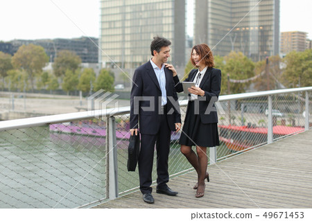 Married business couple make purchases by credit card. 49671453