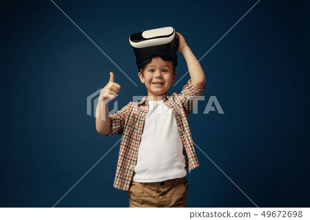 Child with virtual reality headset Child with virtual reality headset 49672698