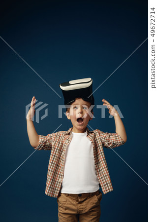 Child with virtual reality headset Child with virtual reality headset 49672714