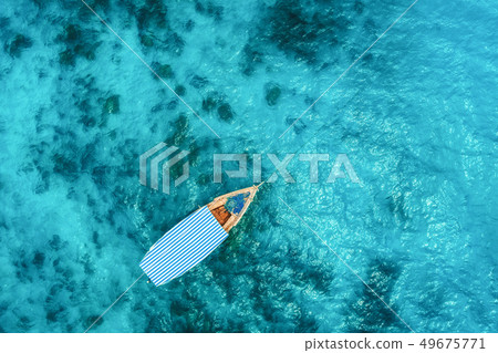 Aerial view of the fishing boat in clear sea 49675771