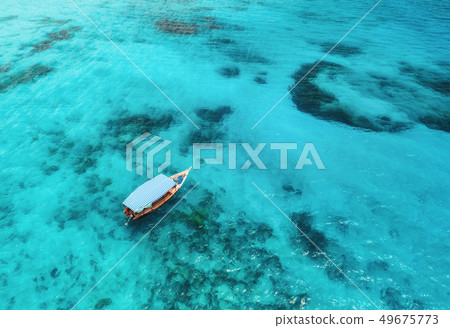 Aerial view of the fishing boat in blue sea Aerial view of the fishing boat in blue sea 49675773