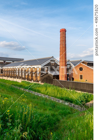 Sake, brick chimney and rape blossoms Kyoto Bushi Sake, brick chimney and rape blossoms Kyoto Bushi 49675820