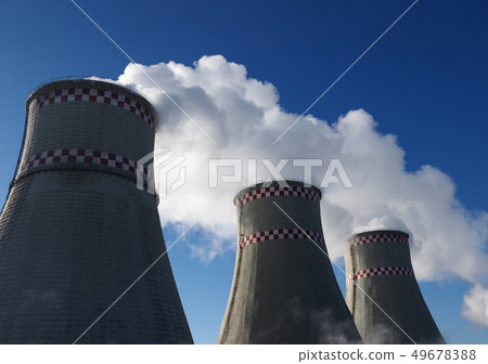 White harmful smog in blue sky vaporing from industrial pipes White harmful smog in blue sky vaporing from industrial pipes 49678388