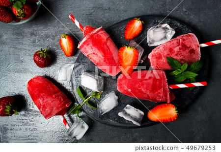 Strawberry popsicle ice cream tabletop view Strawberry popsicle ice cream tabletop view 49679253