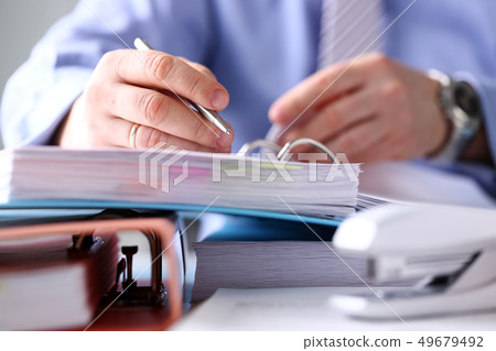 Clerk arm fill and sign important form with silver pen Clerk arm fill and sign important form with silver pen 49679492