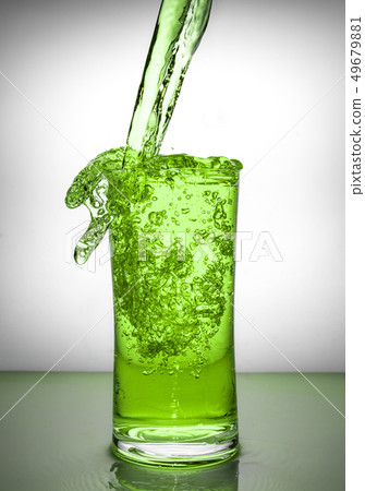 glass with ice and liquid splash 49679881