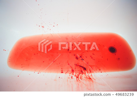 Splashes of blood dripping into the sink in the bathroom. 49683239