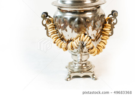 Traditional Russian old samovar for tea drinking with tasty bagels 49683368