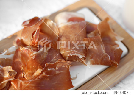 Closeup sliced fresh rolls of jamon. Summer Closeup sliced fresh rolls of jamon. Summer 49684081