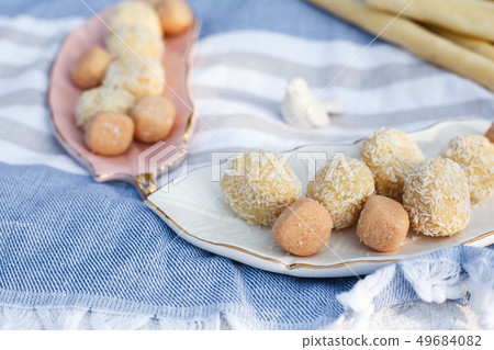 Sugar free hand made sweets layout on plates  49684082