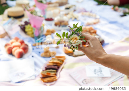 Woman hold fresh rose flower for decoration Woman hold fresh rose flower for decoration 49684083