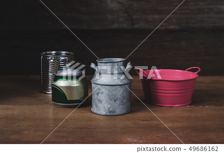 Still life Tin can on wood table background. Still life Tin can on wood table background. 49686162